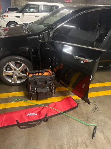 LA Lock Busters technician unlocking car on street in Los Angeles